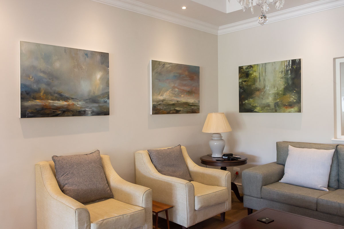 Janet Dirksen's paintings hanging in her lounge